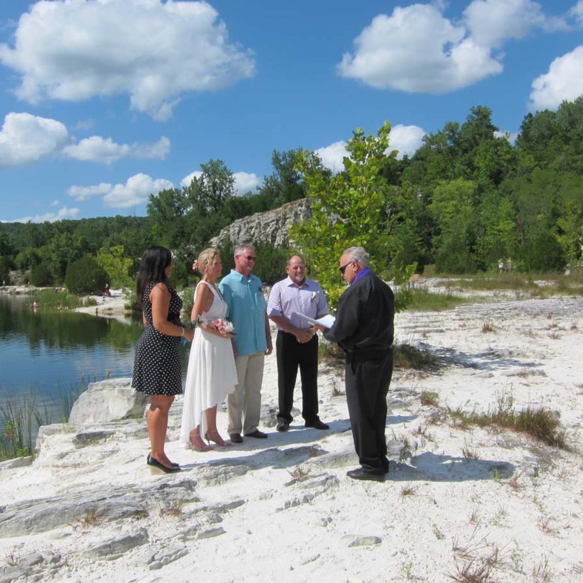 Small wedding ceremony in front of lake
